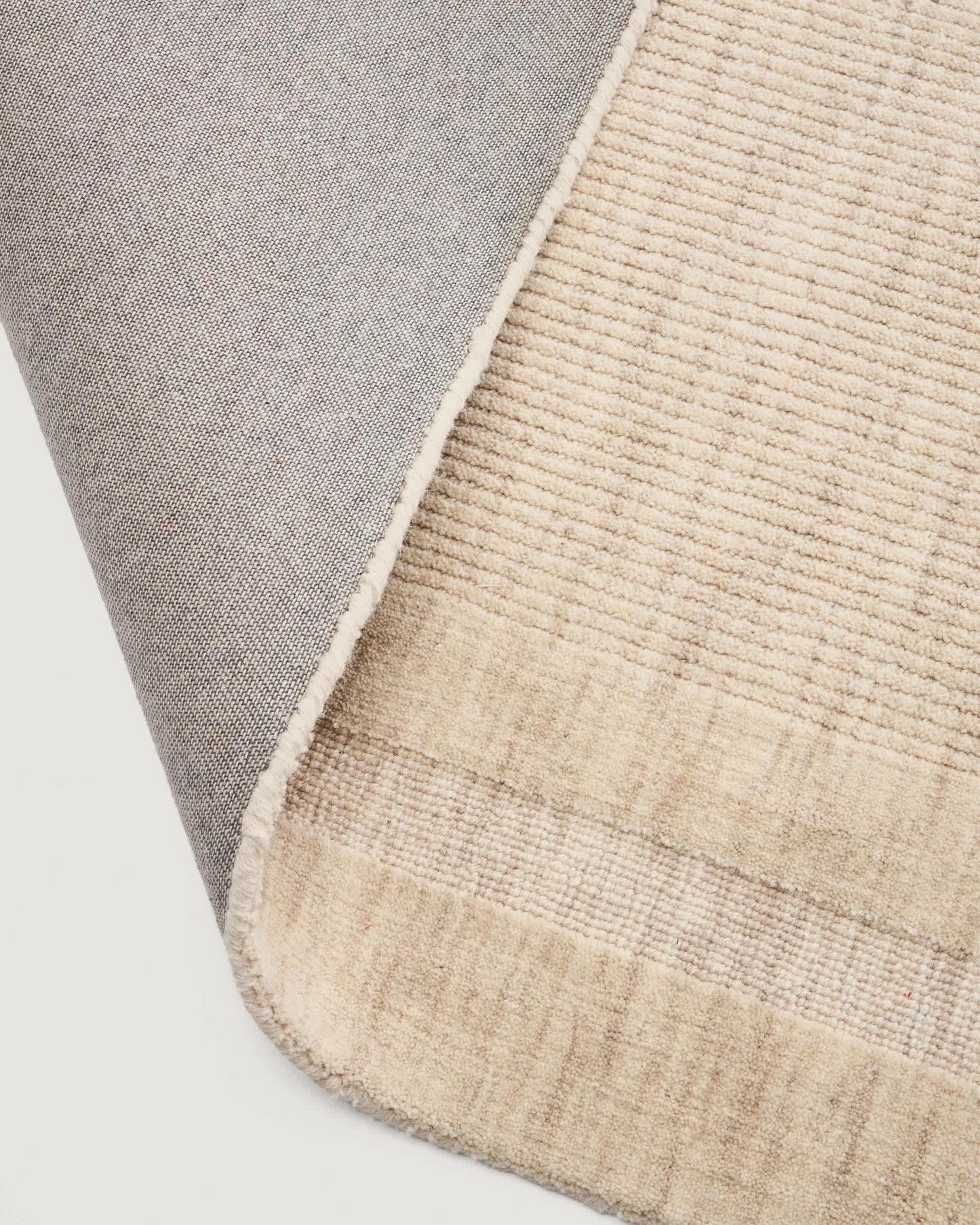 Tappeto Dalena in lana jacquard a righe beige 230 x 160 cm