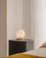 Lampada da tavolo Malachi di vetro glassato e travertino