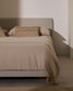 Testiera sfoderabile Valma in ciniglia perla per letto fino a 90 cm.