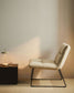 Poltrona Asen in ciniglia beige e gambe in acciaio nero FSC 100%