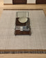 Tappeto Brina in lana jacquard a spina di pesce beige 230 x 160 cm
