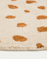 Tappeto rotondo Tandani in cotone beige con disegno di ghepardo arancione Ø 100 cm