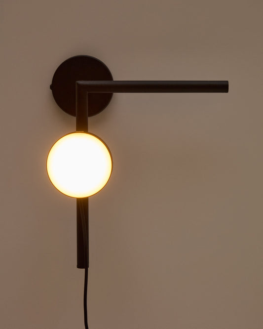 Applique Orey in metallo nero con faretto multiposizione