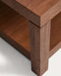 Tavolino da salotto Norani in legno massiccio e impiallacciatura di acacia 150 x 70 cm