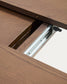 Tavolo rotondo allungabile Artis in legno massiccio e impiallacciatura di rovere con finitura color noce FSC 100% 150 (200) x 80 cm
