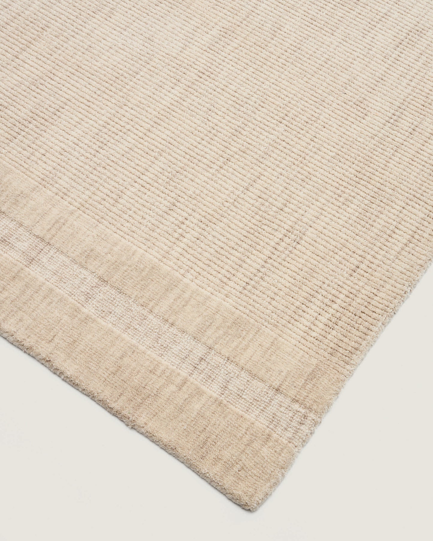 Tappeto Dalena in lana jacquard a righe beige 230 x 160 cm