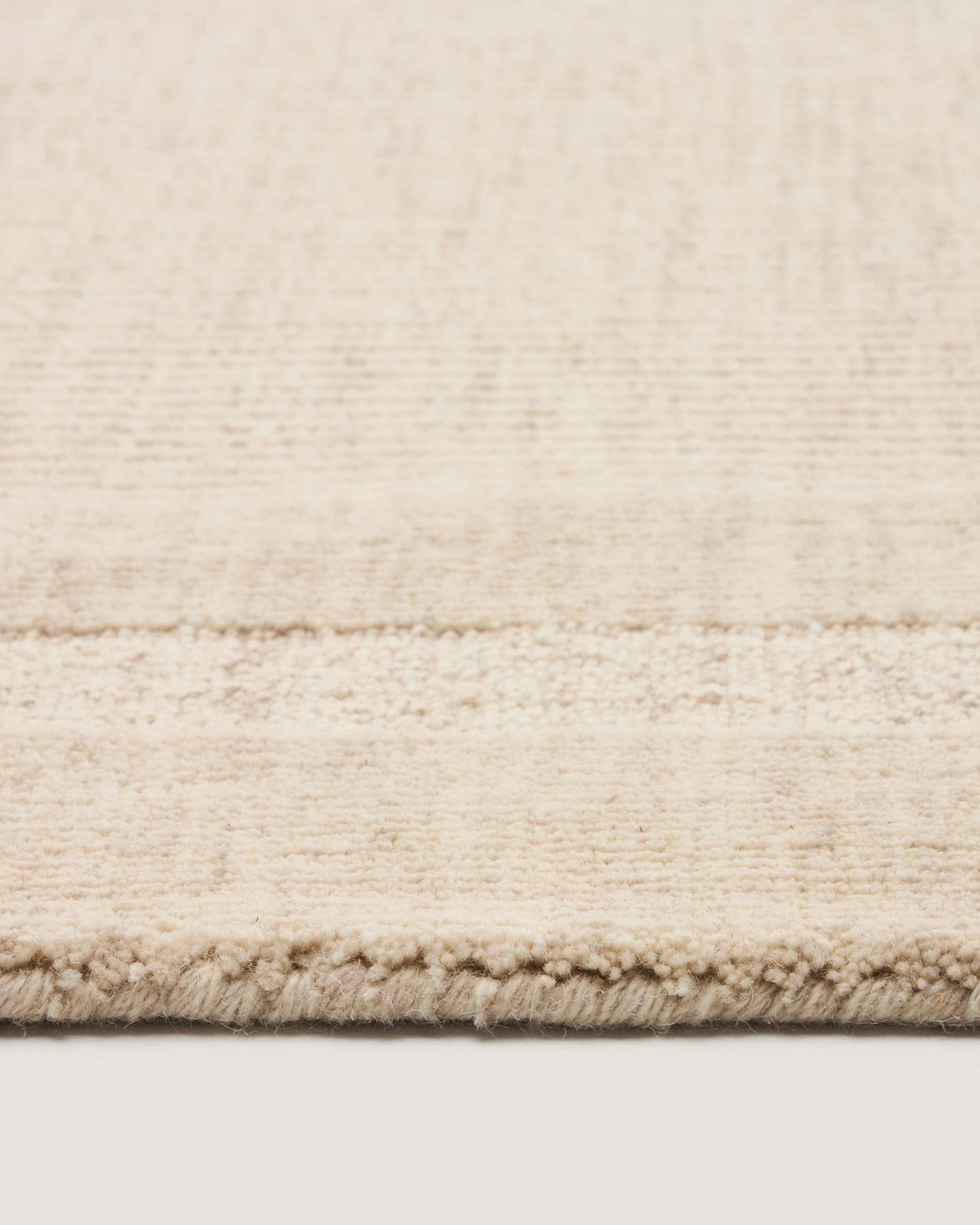 Tappeto Dalena in lana jacquard a righe beige 230 x 160 cm