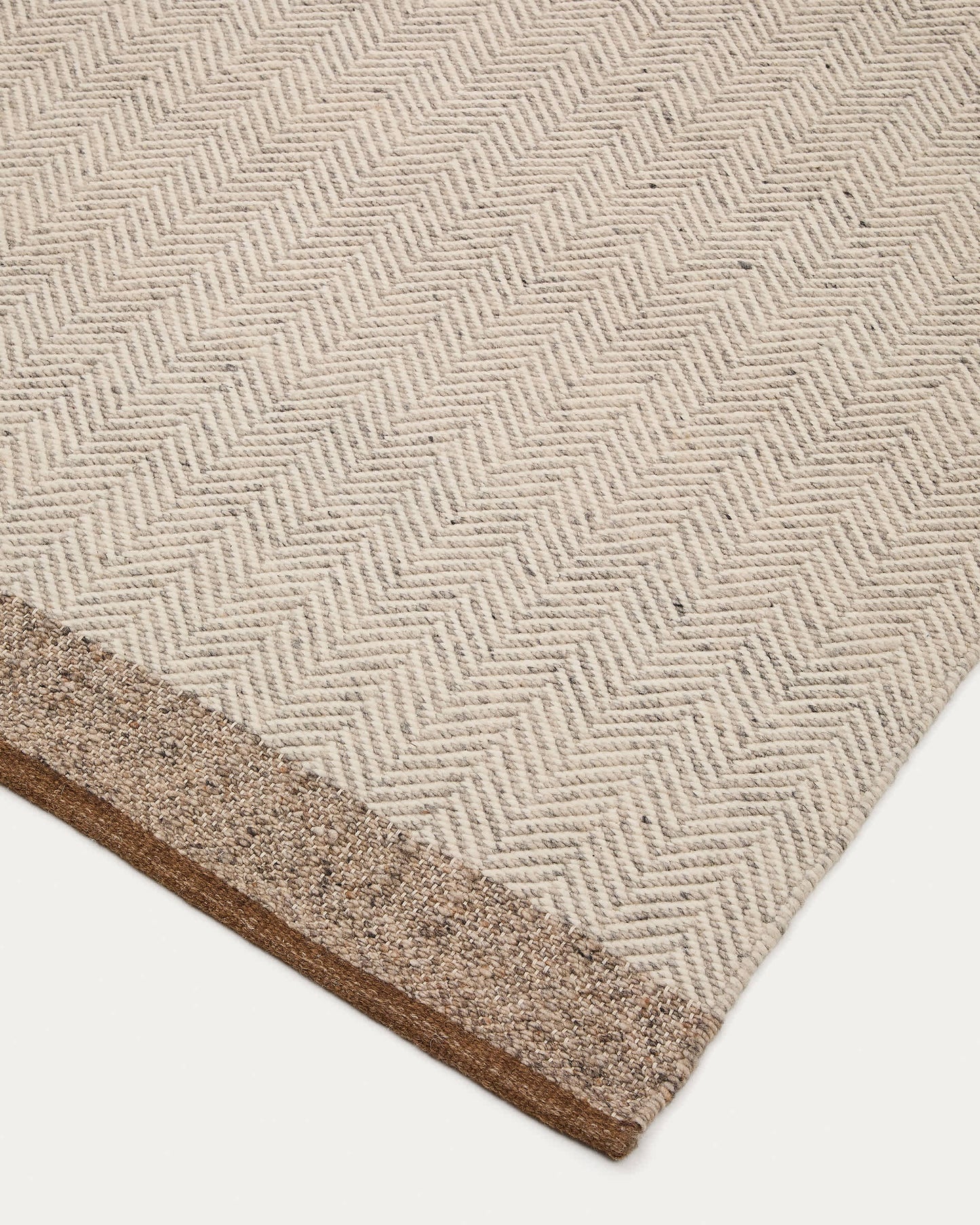Tappeto Nifelia jacquard in lana beige 160 x 230 cm